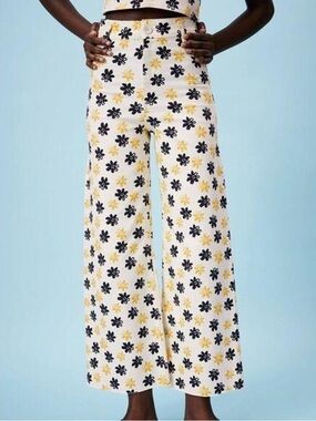 beige zara pants with black and yellow flower patterns. wide, high-waisted pants